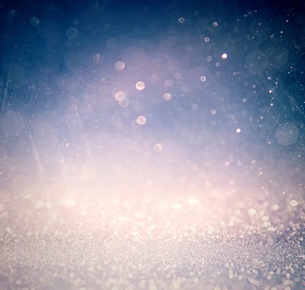 Glitter vintage lights background with light burst . silver, blue and white. de-focused. — Stock Photo, Image