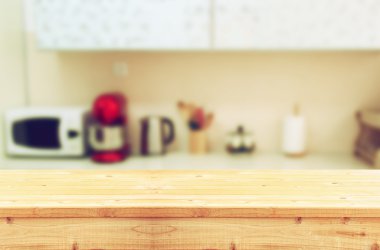 empty table board and defocused white retro kitchen background clipart