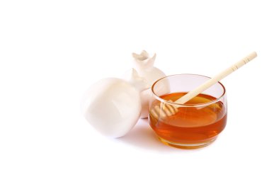 Rosh hashanah (jewesh tatil) kavramı - bal ve nar beyaz izole. geleneksel tatil sembolleri.