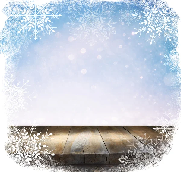 Wood table with snowflake frame — Stock Photo, Image