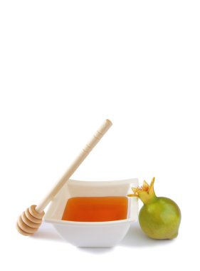 Rosh hashanah (jewesh tatil) kavramı - bal ve nar beyaz izole. geleneksel tatil sembolleri.