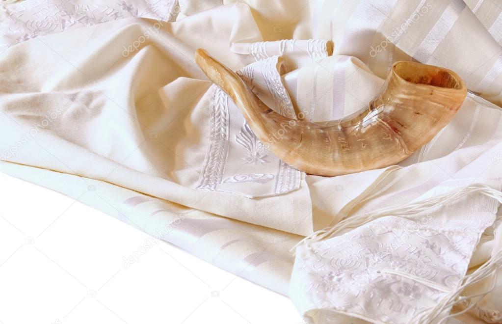 shofar (horn) on white prayer talit. rosh hashanah (jewish holiday) concept . traditional holiday symbol.