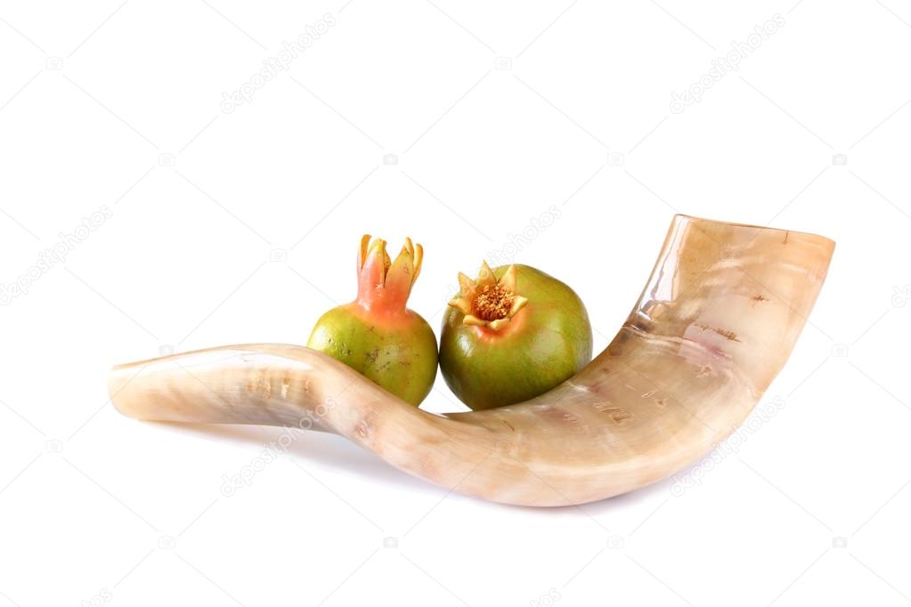 shofar (horn) and pomegranate isolated on white. rosh hashanah (jewish holiday) concept . traditional holiday symbol.
