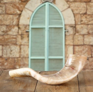 shofar (horn) on wooden table. rosh hashanah (jewish holiday) concept . traditional holiday symbol.