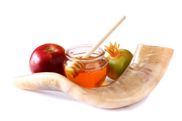 shofar (horn), honey, apple isolated on white. rosh hashanah (jewish holiday) concept . traditional holiday symbol.