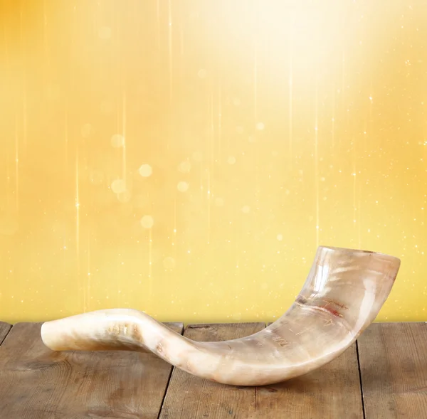 Shofar (horn) on wooden table. rosh hashanah (jewish holiday) concept . traditional holiday