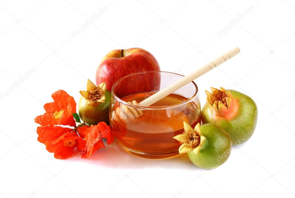 rosh hashanah (jewesh holiday) concept - honey, apple and pomegranate isolated on white. traditional holiday symbols.