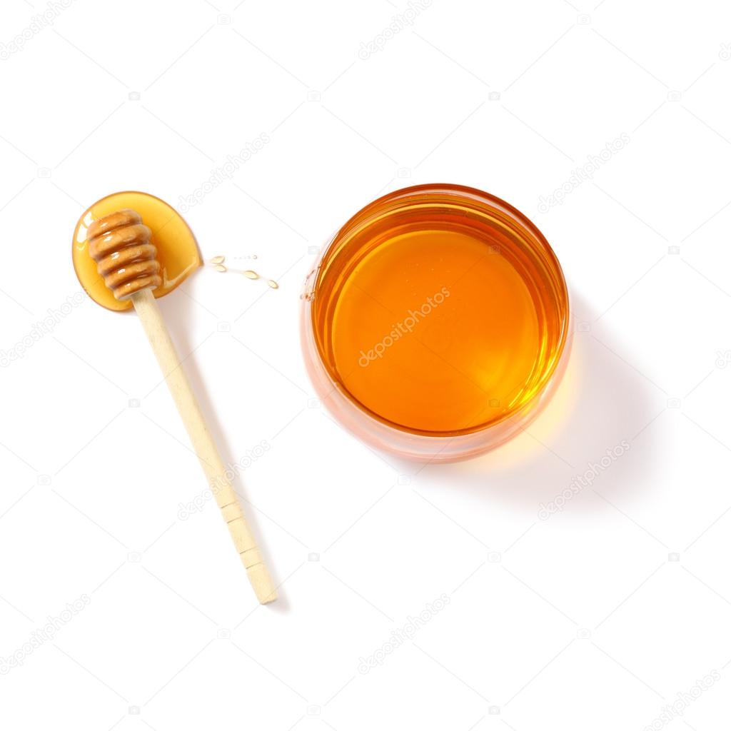 rosh hashanah (jewesh holiday) concept - top view of honey isolated on white. traditional holiday symbols.