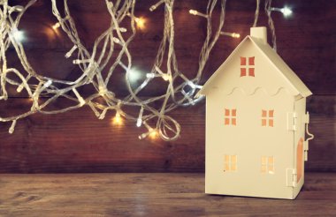 House lantern with burning candles