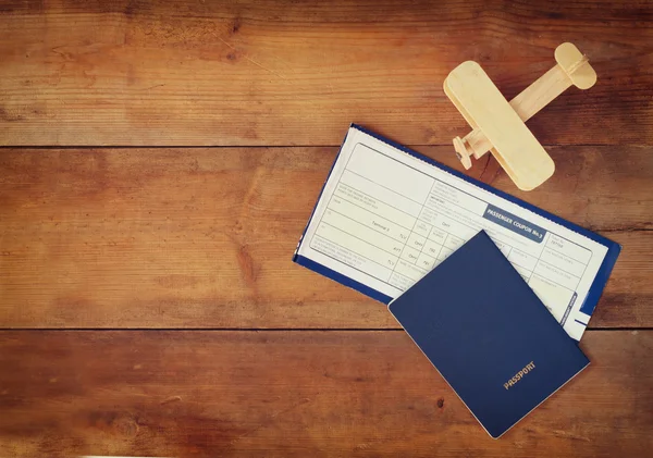 Flying ticket and wooden airplane — Stock Photo, Image