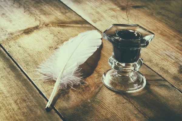 White feather and inkwell — Stock Photo, Image