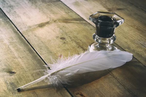 White feather and inkwell — Stock Photo, Image