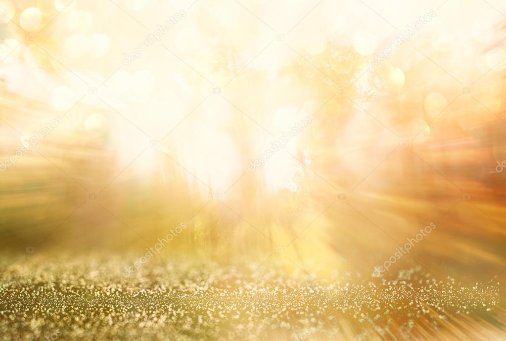 abstract photo of light burst among trees and glitter bokeh lights