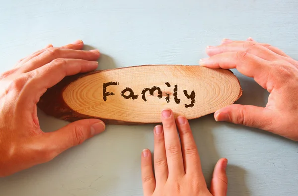 Father and child holding sign with the word family. — Stock Photo, Image