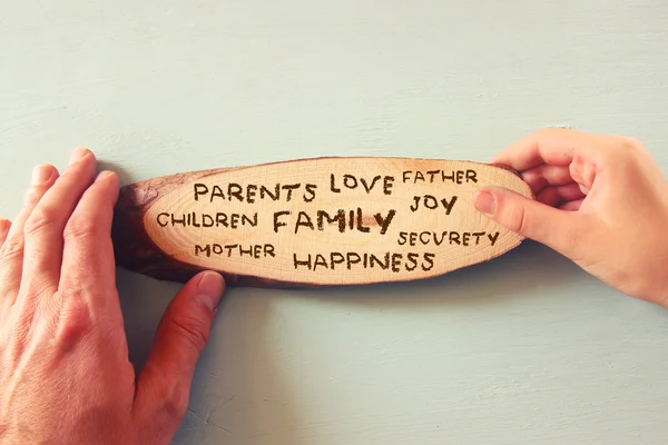 Father and child holding sign with family values text. — Stock Photo, Image