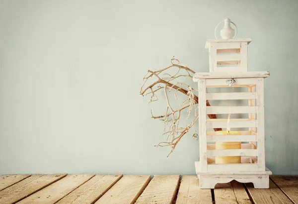 Wooden lantern over table — Stock Photo, Image