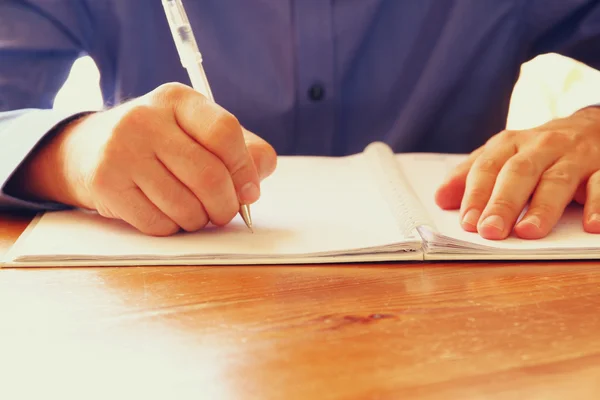 Close up image of male hands writing at notebook. selective focus — Stock Photo, Image