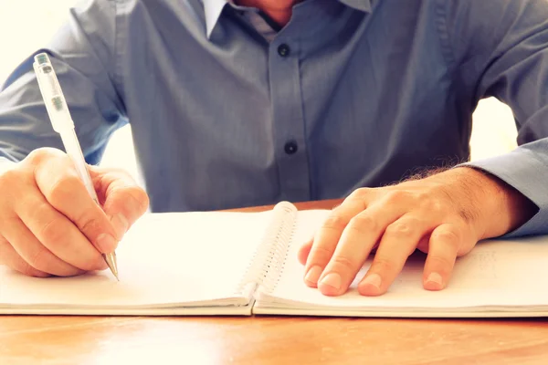 Close up image of male hands writing at notebook. selective focus — Stock Photo, Image