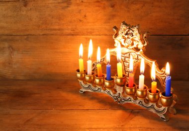 Image of jewish holiday Hanukkah background with menorah (traditional candelabra) and Burning candles. clipart