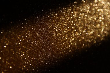 Glitter vintage ışıklar arka plan. altın rengi ve siyah. defocused.