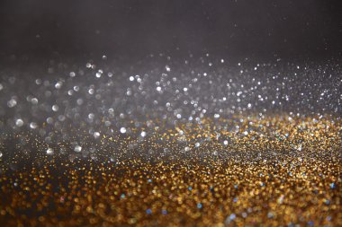 Glitter vintage ışıklar arka plan. Altın, gümüş, mavi ve siyah. de-odaklı