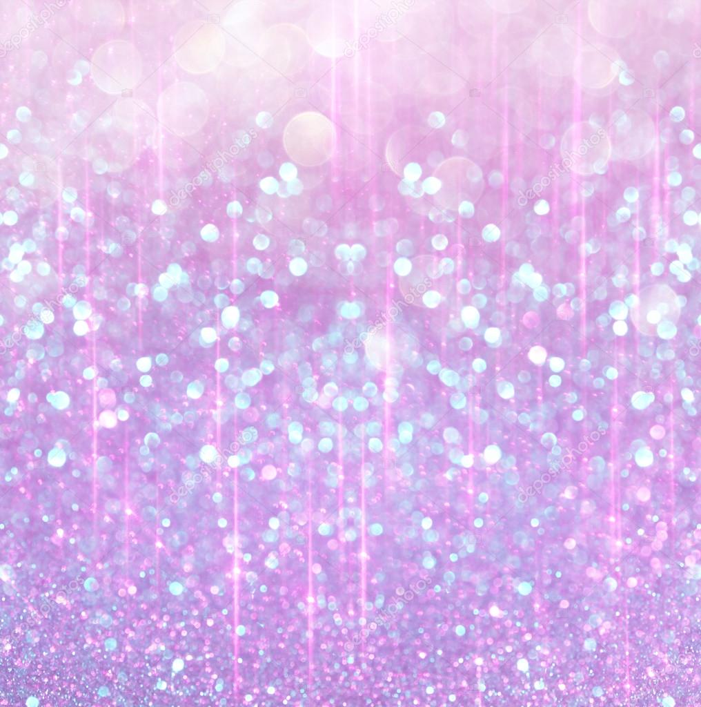 bokeh lights background with multi layers and colors of white silver and blue.
