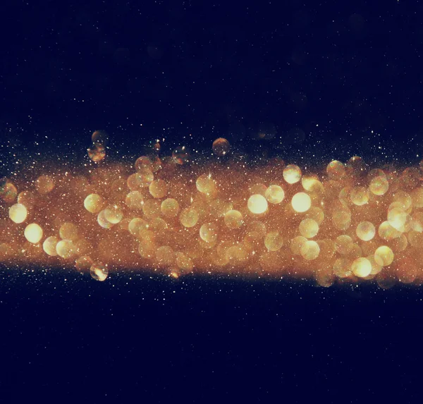 Glitter vintage lights background. gold, silver, and black. de-focused — Stock Photo, Image