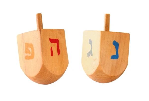 Dreidels coloridos de madeira (parte superior girando) para férias judaicas hanukkah isoladas no branco . — Fotografia de Stock