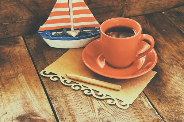 Cup of tea and decorative boat — Stock Photo, Image