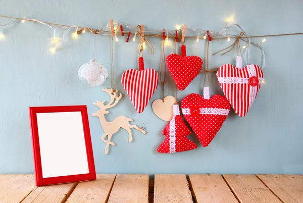 Fabric hearts, frame and garland lights — Stok fotoğraf