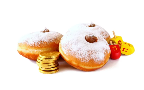 Image of jewish holiday Hanukkah with donuts, traditional chocolate coins and wooden dreidels (spinning top). isolated on white. — Stock Photo, Image