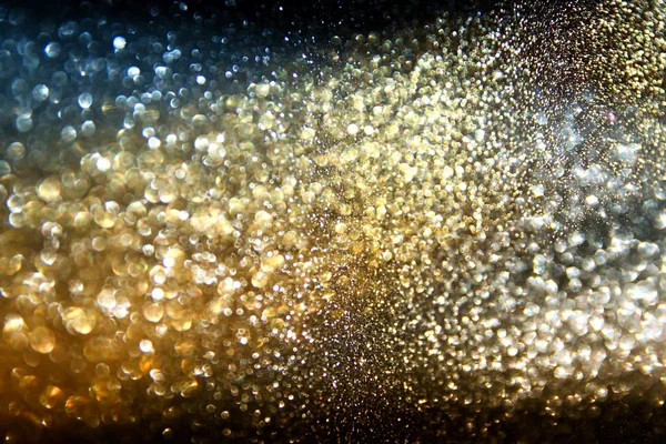 Glitter vintage lights background. gold, silver, and black. de-focused — Stock Photo, Image