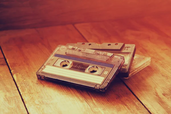 Cassette tape over wooden table — Stock Photo, Image