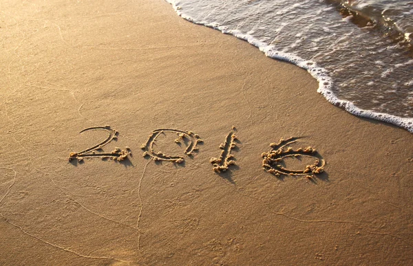 New year 2016 written in sandy beach — Stock Photo, Image