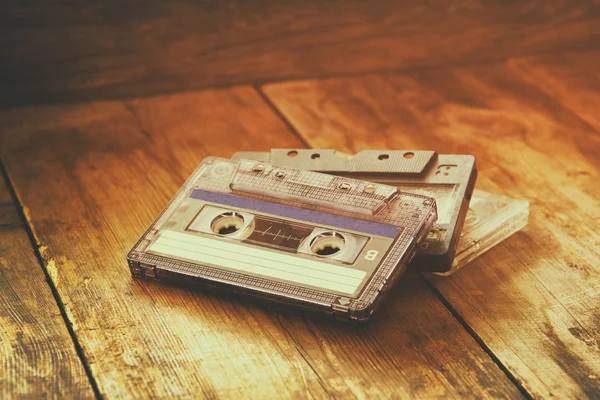 Cassette tape over wooden table — Stock Photo, Image