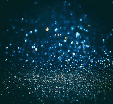 Glitter vintage ışıklar arka plan. Altın, gümüş, mavi ve siyah. de-odaklı