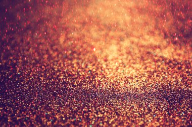 Pırıl pırıl ışıklar arka plan. Koyu altın ve siyah. Odaklanamadı.