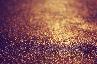 Pırıl pırıl ışıklar arka plan. Koyu altın ve siyah. Odaklanamadı.