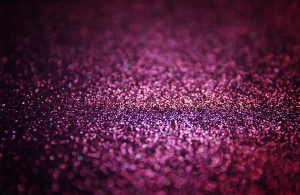 Abstract glitter purple lights background. — Stockfoto