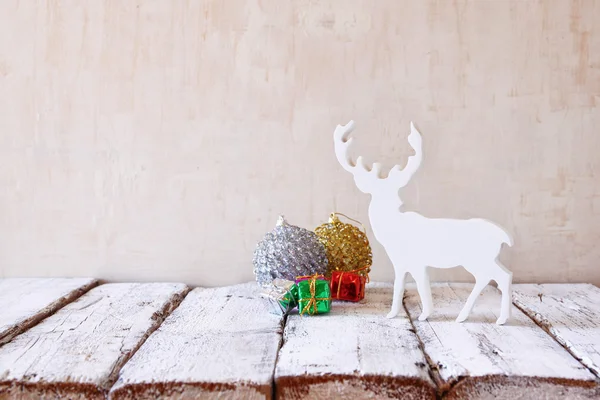 Christmas decorations and white raindeer — Stock Photo, Image