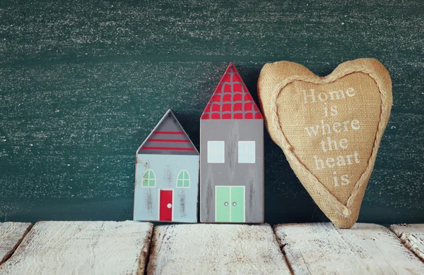 Wooden houses and fabric heart — Stock Photo, Image