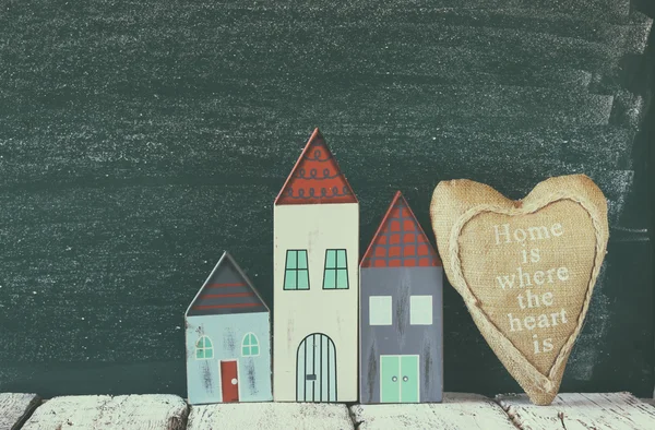 Wooden houses and fabric heart — Stock Photo, Image