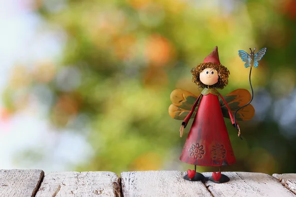 Cute fairy on wooden table — Stock Photo, Image