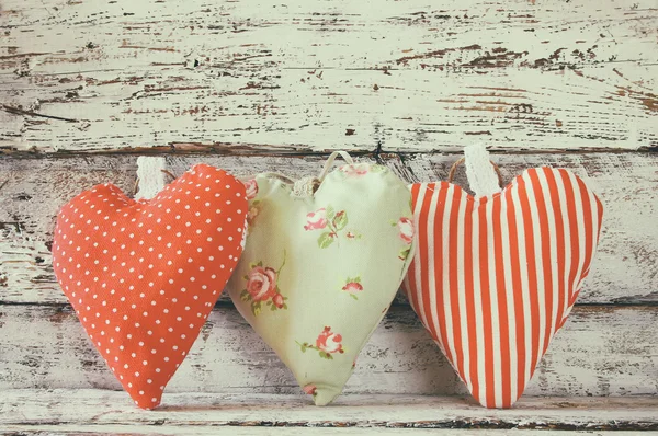 Image of colorful fabric heart on wooden table. valentine's day celebration concept. retro faded style filtered photo. — Φωτογραφία Αρχείου