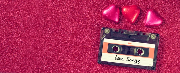 Website banner image of colorful heart shape chocolates and audio cassette on glitter  background. valentine's day celebration concept. retro toned and filtered. — Φωτογραφία Αρχείου