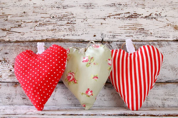 Image of colorful fabric heart on wooden table. valentine's day celebration concept. — Stock fotografie