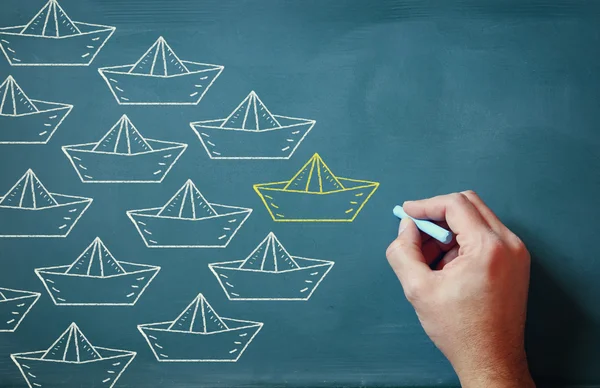 Leadership Concept image, male hand drawing boats over chalkboard — 스톡 사진