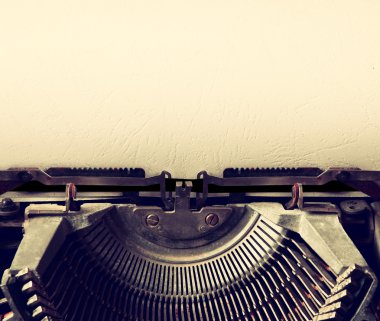 close up image of typewriter with paper sheet. copy space for your text. terto filtered