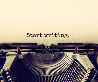 close up image of typewriter with paper sheet and the phrase: start writing . copy space for your text. terto filtered