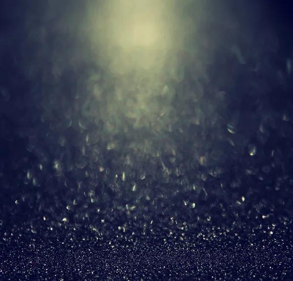 Glitter vintage luci di sfondo. argento chiaro, oro, blu e nero. sfocato . — Foto Stock